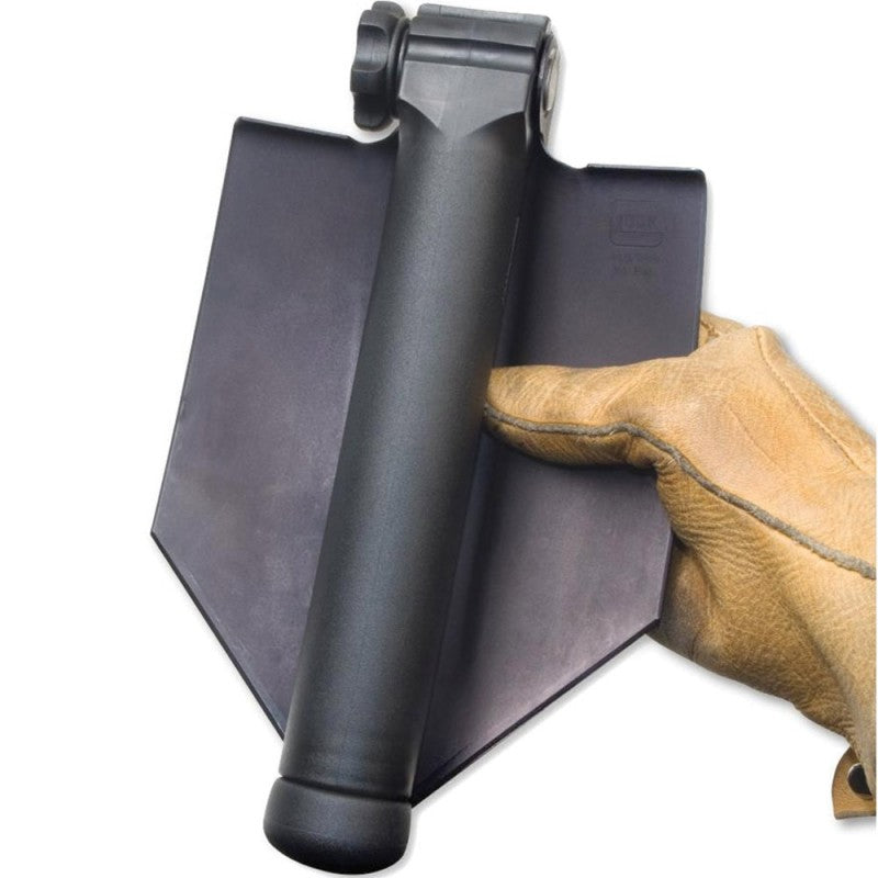 Pelle GLOCK dépliée montrant le système de pliage breveté et la robustesse de l'acier inoxydable